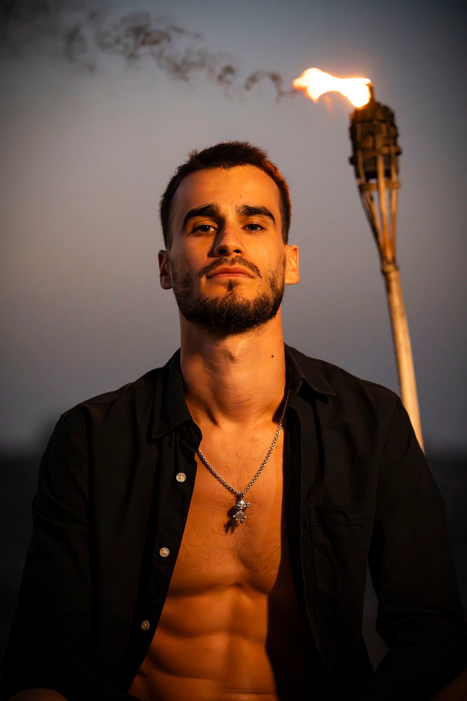 man is wearing tahos jewel as necklace