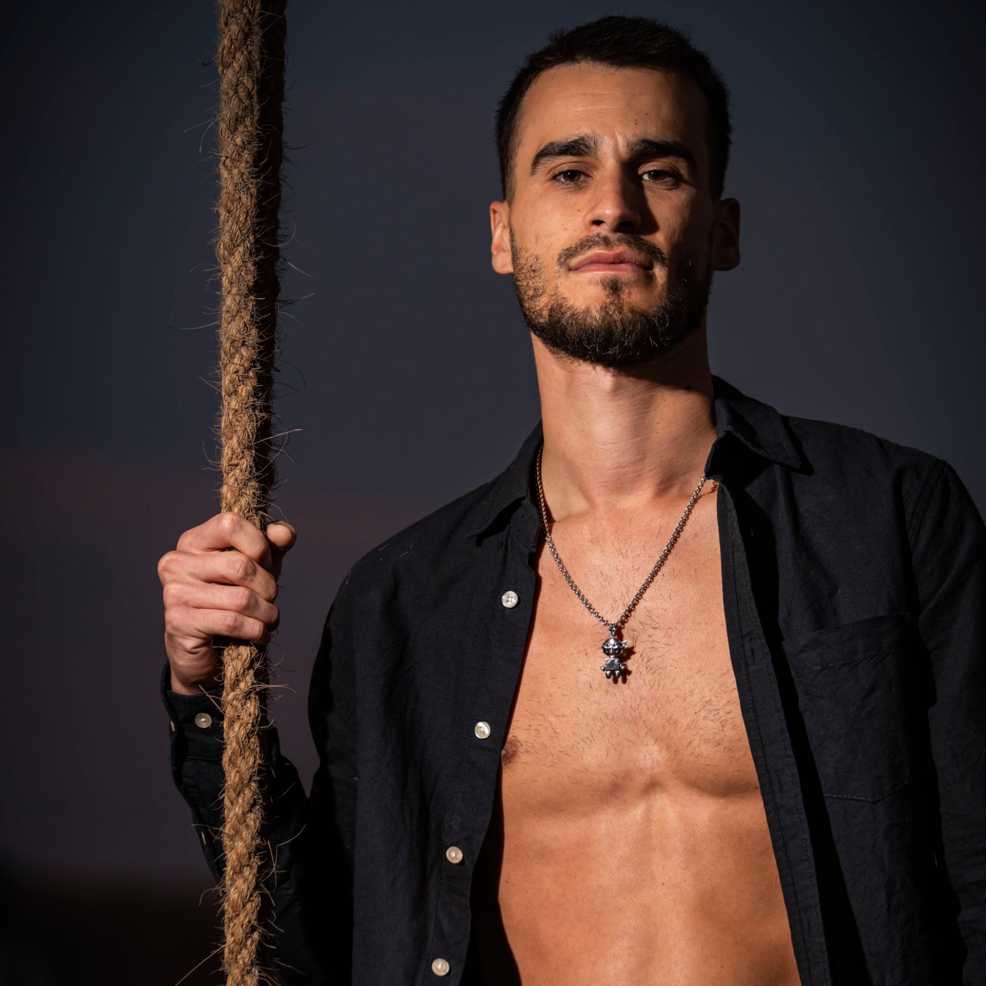 man is wearing tahos jewel as necklace